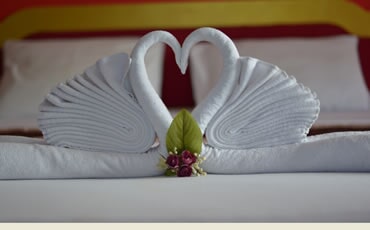 Folded towel decoration on a hotel bed